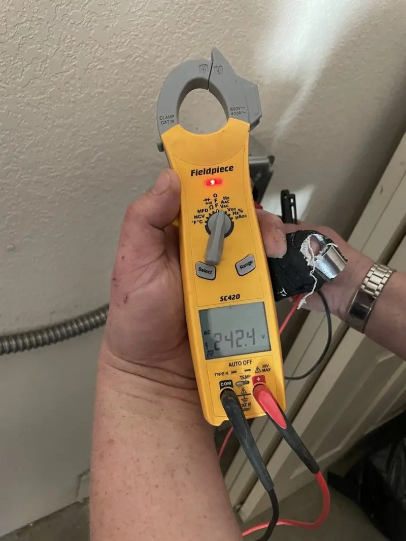 Voltage testing with clamp meter during Outlet Installation in Socorro